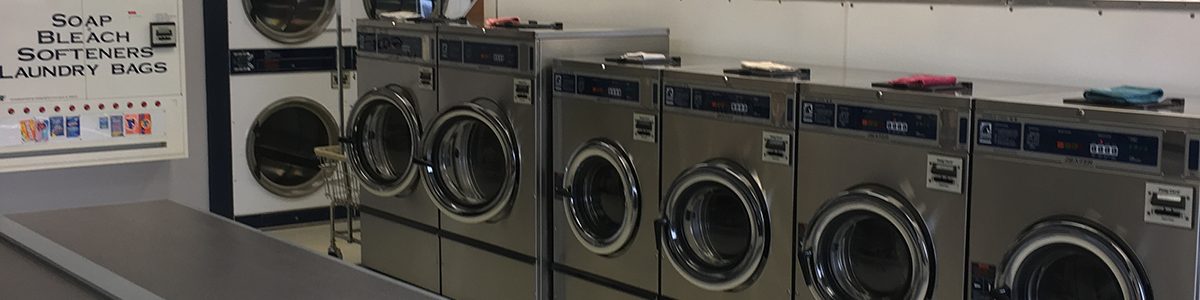 Towne Laundry interior with rows of Dexter washers and dryers